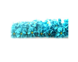 PASTILLAJE AZUCAR FLOR REHILETE AZUL CLARO  2X2 CM 40 PZS. A